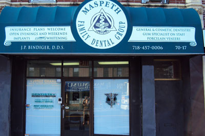 The image shows a storefront with a sign that reads MASPETH FAMILY DENTAL CLINIC and includes contact information, indicating that this is a dental clinic located at 637 Maple Street in Maspeth, New York.